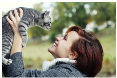 woman holding cat 